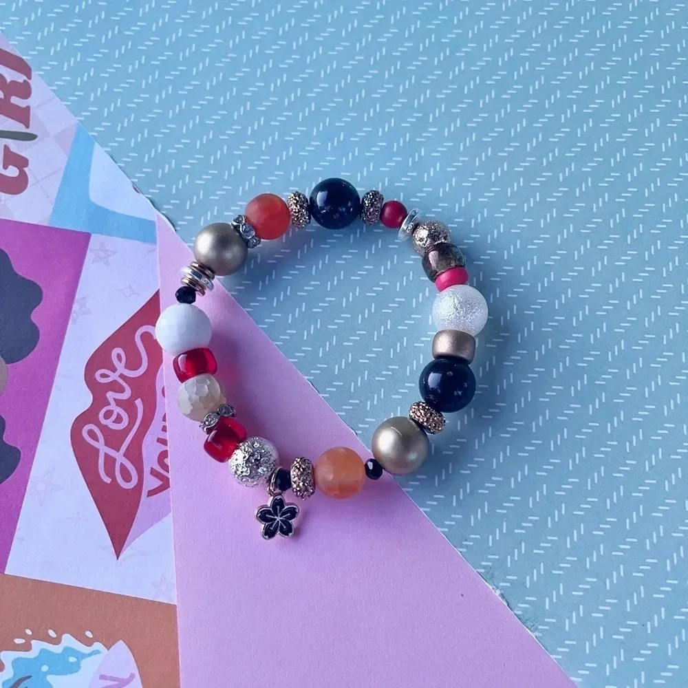 Handmade beaded statement bracelet with flower charm - Picture 3 of 4